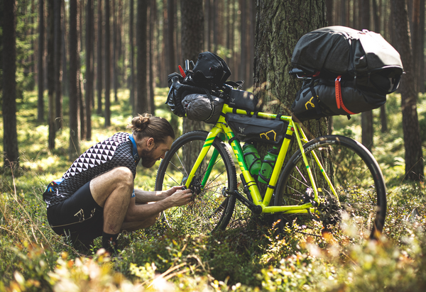 Man looking at Bicycle 